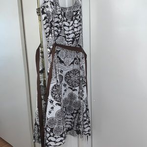 White and brown dress with floral pattern.